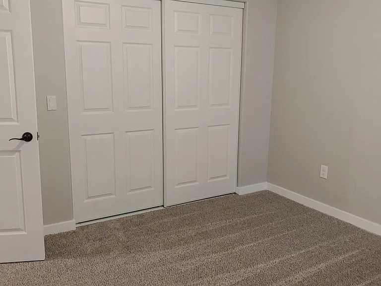 Downstairs Bedrooms with Sliding door closets.