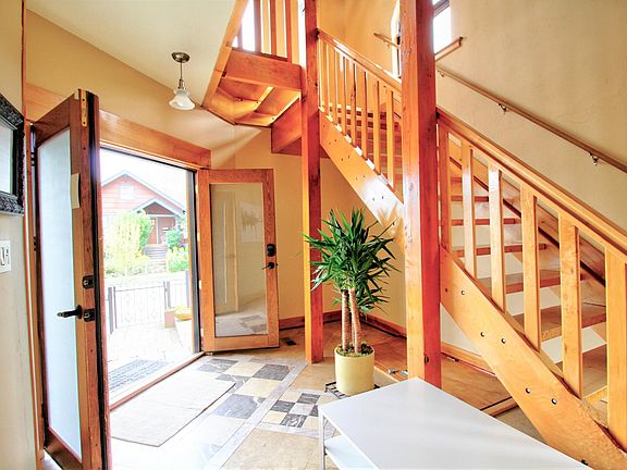 Entrance and stairs up to the kitchen, dining, living room
