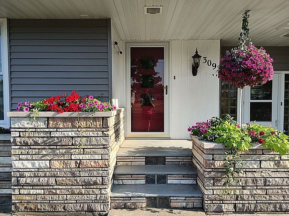 Welcomed by pretty planters
