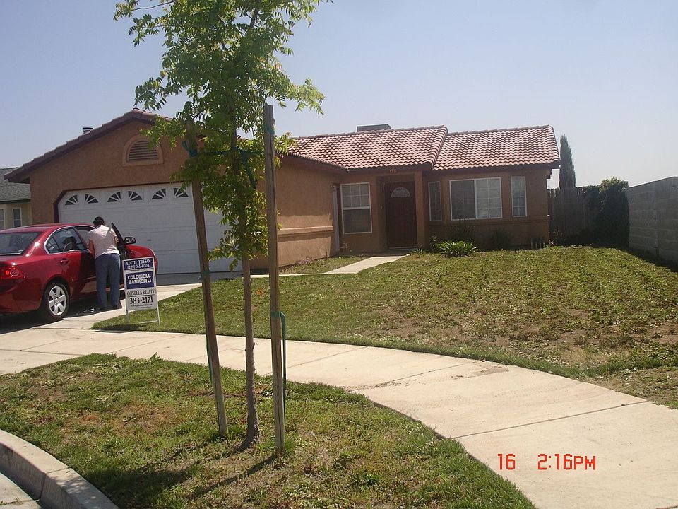 CORNER HOUSE WITH BRICK WALL TO LEFT 