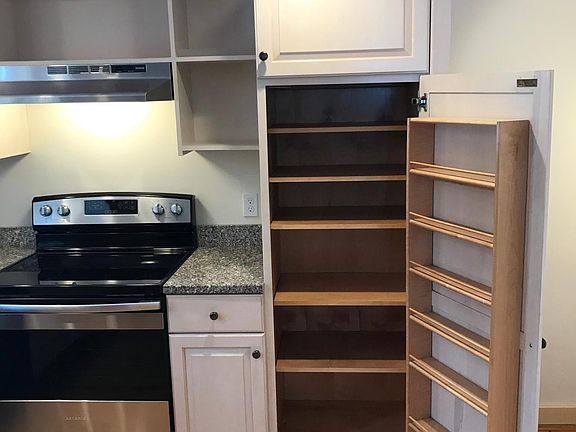 Kitchen has granite counters, tons of cabinet space.