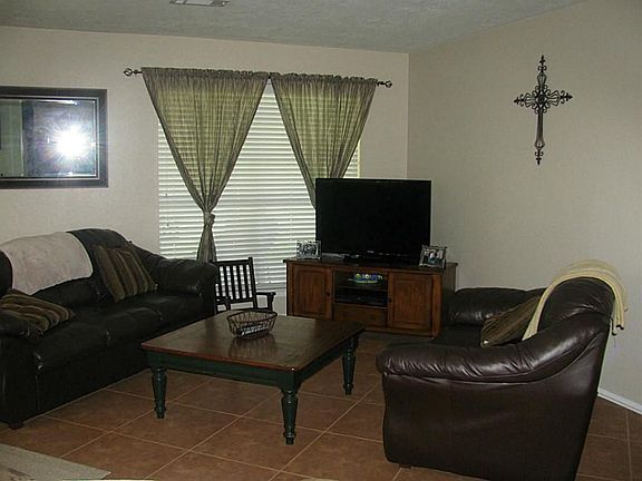 Open & inviting den with tile floors