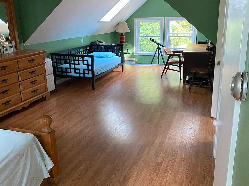 master bedroom with spare bed and office