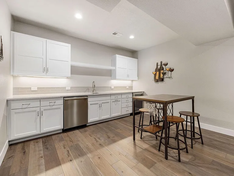 The huge lower level has a full wet-bar, a 65 inch Smart TV with included Comcast cable and high-speed wifi. One of the 4 bedrooms is in this area.