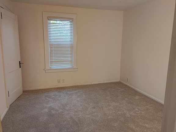 Bedroom has brand new carpet, a large hanging closet and also a storage closet