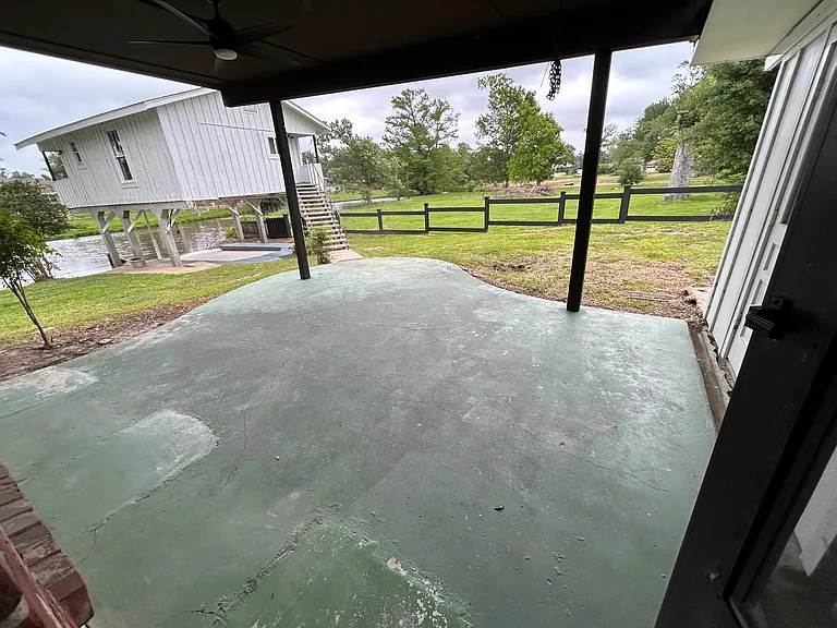 back patio and showing the boat house poach is stained gray now