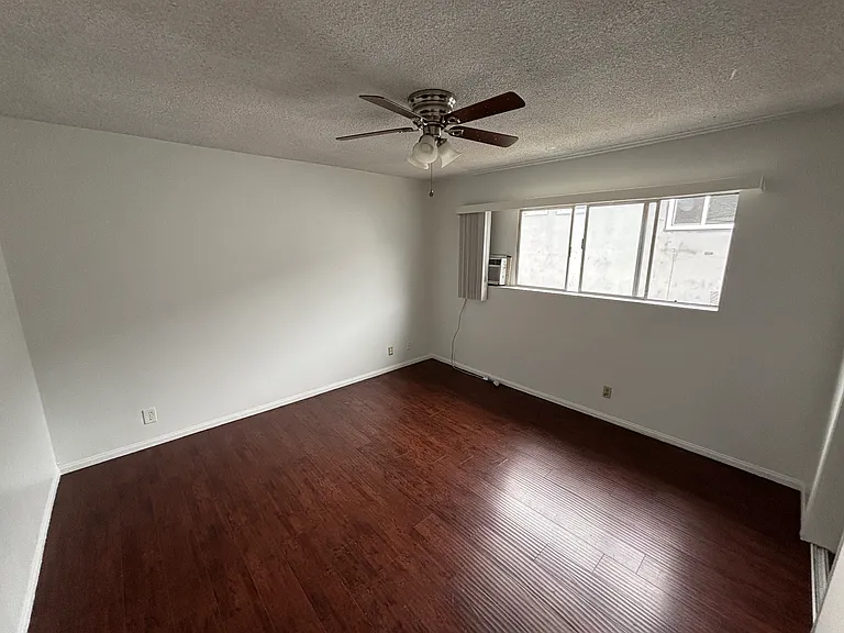 Bedroom #2 with AC unit and ceiling fan