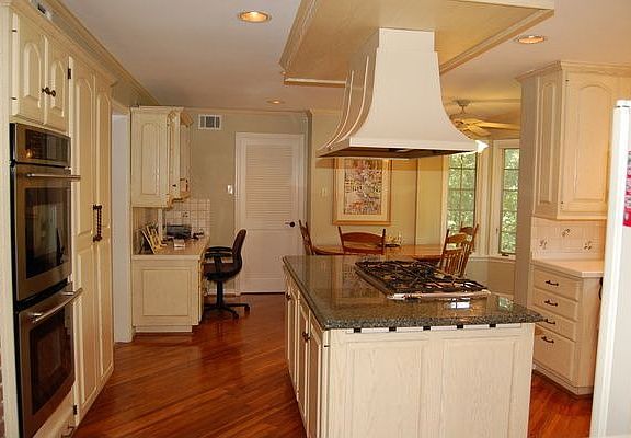 Kitchen with granite, stainless appliances and harwood flooring