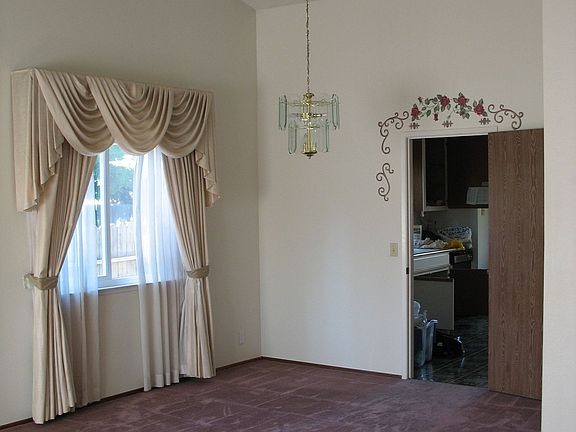 Dining Room area with Vaulted Ceiling & Custom Drapes