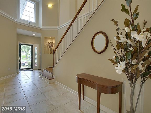 Two Story Foyer w/ custom tile flooring
