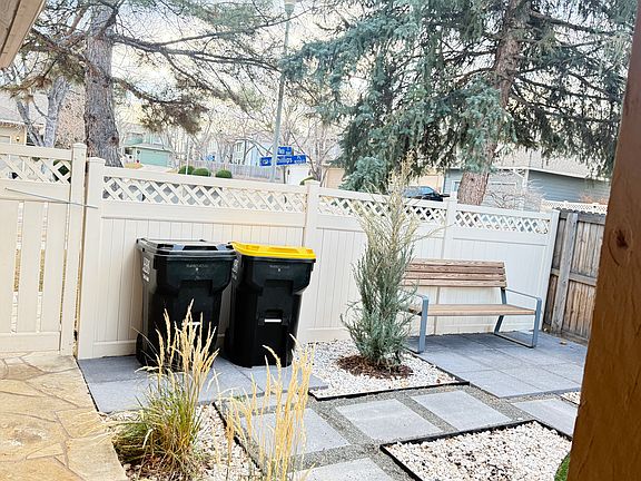 view from front door, assigned area for trashcans