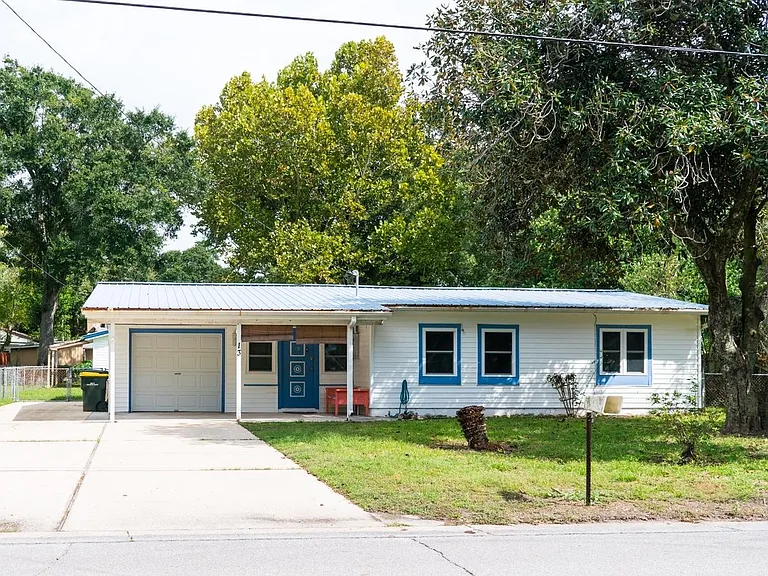 Front of home with ample parking.