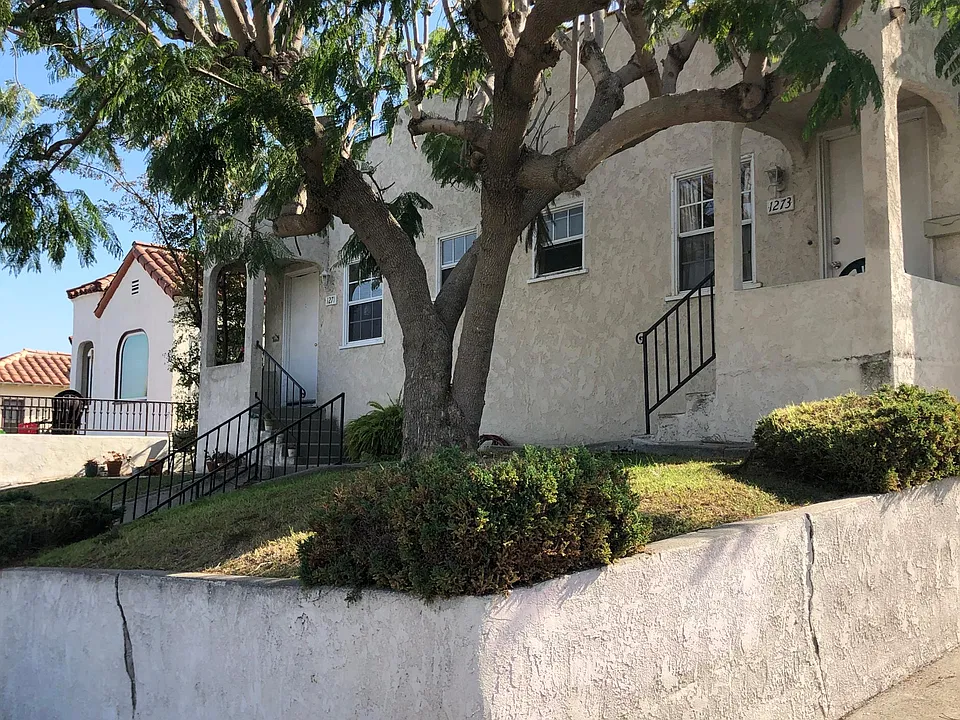 Front of 4 plex. Available unit in the rear.