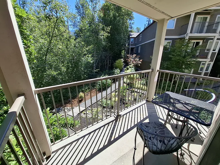 A wonderful place for morning coffee. Greenbelt pictured to left; courtyard to the right.