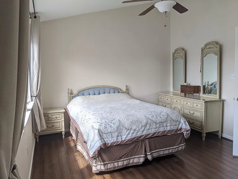 Main bedroom has wood floor