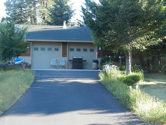 Asphalt drive to 2 bay shop