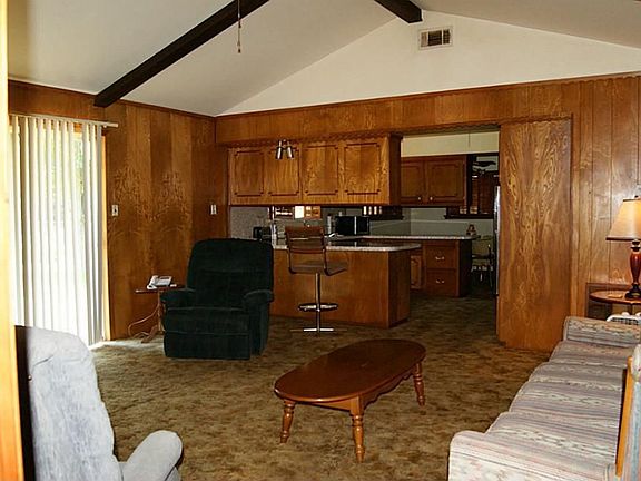 Spacious vaulted den opens to kitchen & dining, sliding doors lead to back yard!