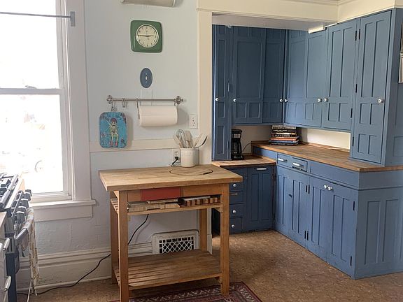 Kitchen with built in cabinets and buther block top