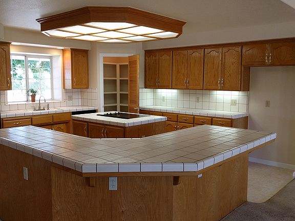 Kitchen has step-in pantry