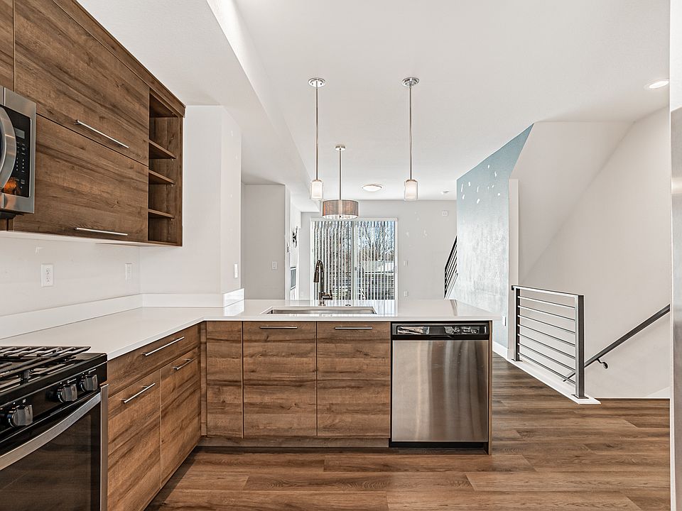 Kitchen with stainless steal appliances, gas stove, and refrigerator with water filter -- second floor.