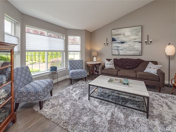 Formal living room has vaulted ceiling