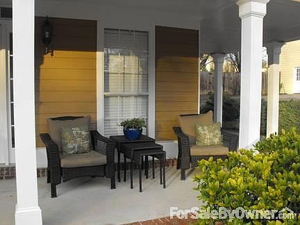 Side of house with fenced back yard