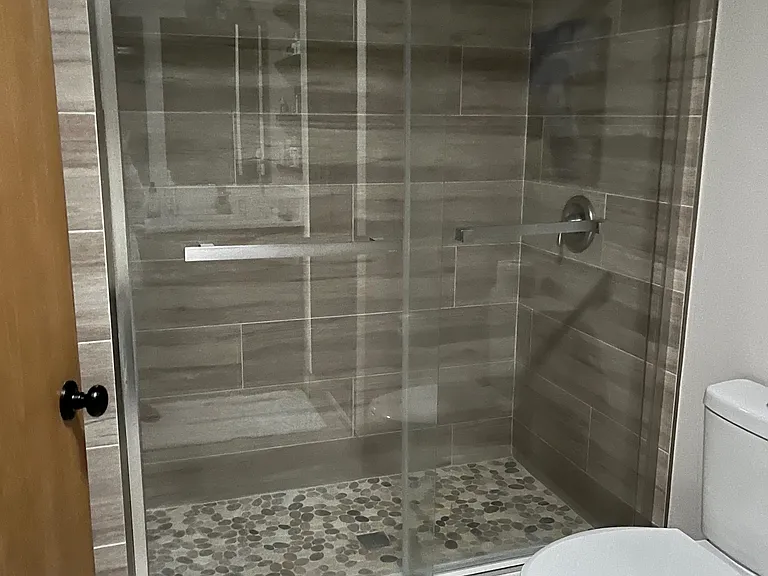 primary bathroom. Has double sink and large linen closet.