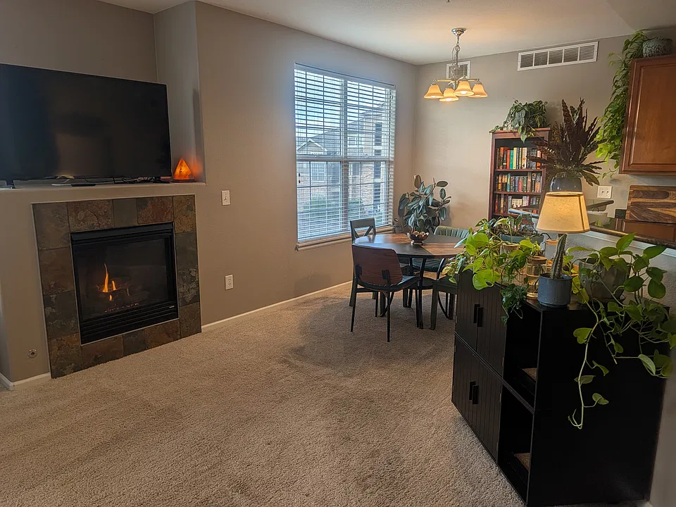 Open concept layout features dinning area adjacent to living area with additional large north-facing windows