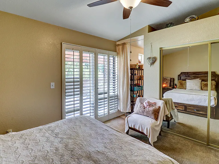 Primary Bedroom Patio Doors and Plantation Shutters