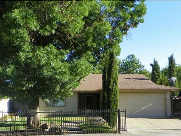 Fenced yard with large garage