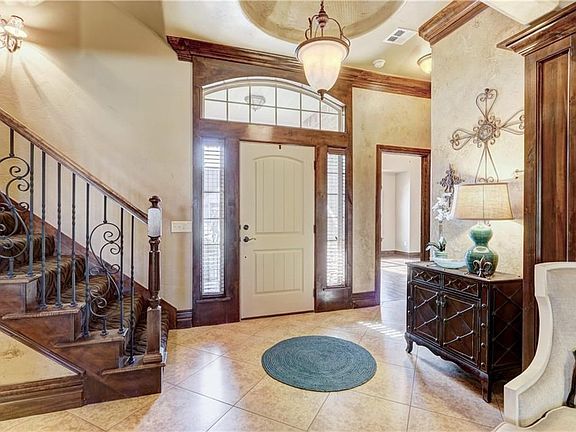 Beautiful entry with carpeted stairs that lead up to your bonus/5th bedroom space!