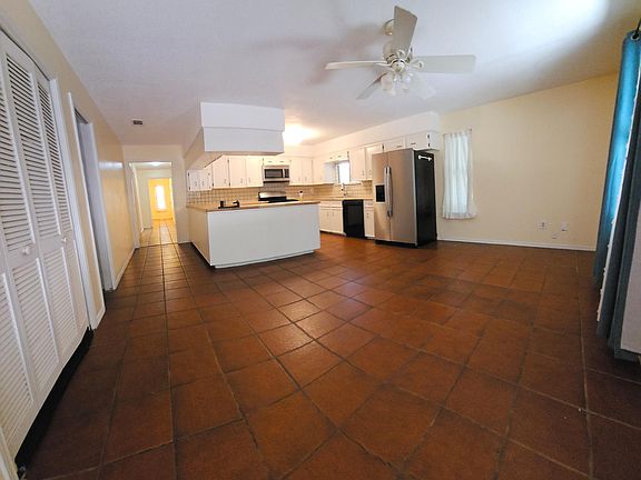 Big kitchen with butcherblock counters, tons of storage, newer gas range, big fridge, big attached dining area.