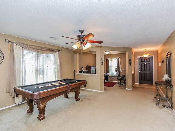 Formal dining currently being used as a game room.