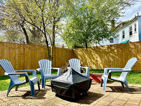 Nice sized back yard with brick paver patio (furniture/fire pit not included)