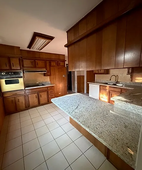 Kitchen (before new light fixture installed). View from doorway to Living room.