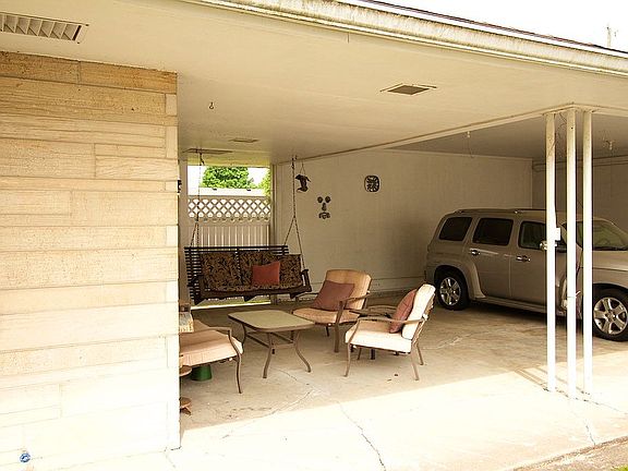 Covered attached carport