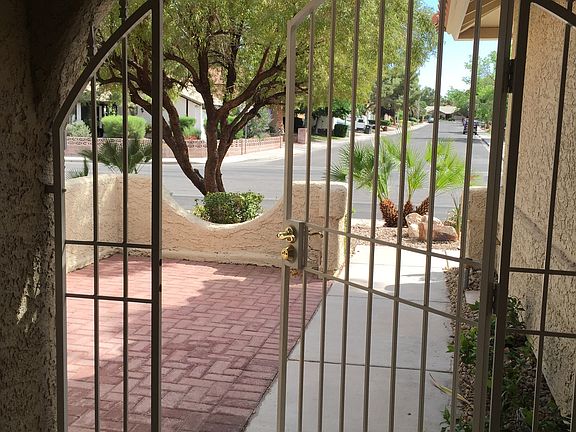 Front court yard with wrought iron security gate.