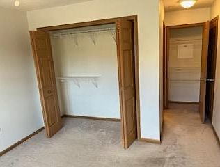 Master bedroom with large closet, storage closet and bathroom.