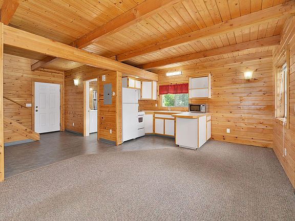 Kitchen; living room; light and bright; no sheetrock.