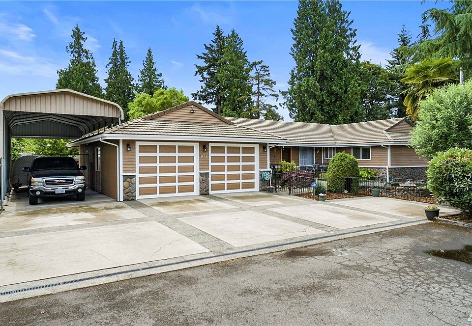 Oversize 2-car garage. Attached 52' x 12' cover RV Parking with septic/water/120amp hookup!  Located at the end of the cul-de-sac!