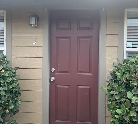 Unit 3 Front Door, as of 10/16/24 Door is now Black with White Trim and Black Gutters