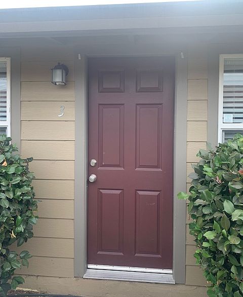 Unit 3 Front Door, as of 10/16/24 Door is now Black with White Trim and Black Gutters