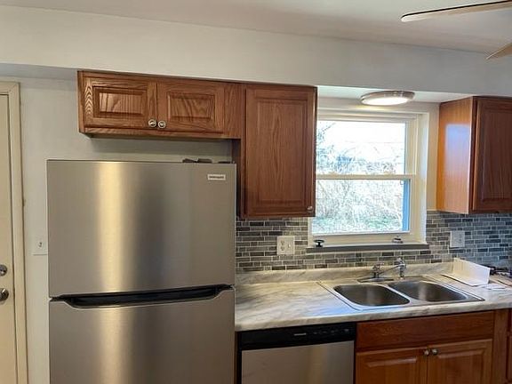 Kitchen - NEW appliances, NEW cabinets, NEW counter top, NEW back splash, NEW flooring, NEW ceiling fan, NEW back door, NEW storm door