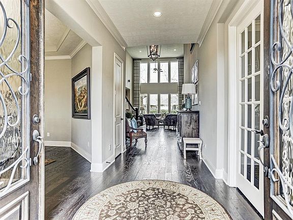 Enter this beautiful home through the gorgeous detailed double doors.