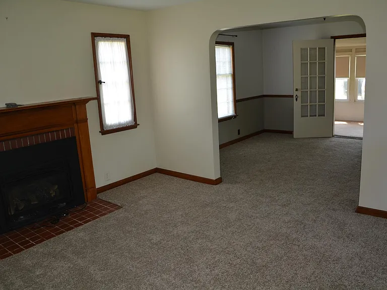 Family room into dining room and onto sun porch.