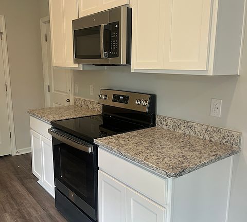 Electric range, microwave, dishwasher. (refrigerator to come!)