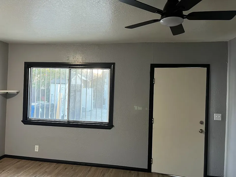 Main entrance door. Livingroom area, next to the kitchen.