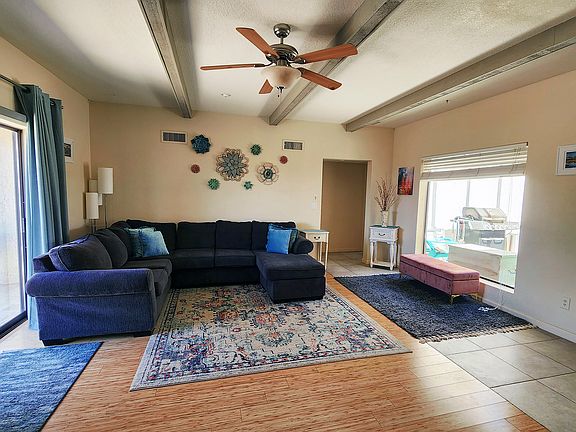 Plenty of room for everyone in this spacious living room with plenty of light or option to tone it down for some relaxation.