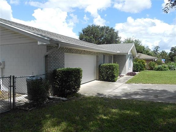 Side view of the property, just outside the double gate to the back yard.