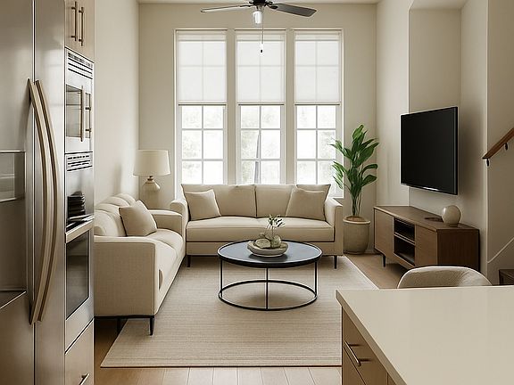 Open plan into the living room. A/V already installed for easy TV mounting.